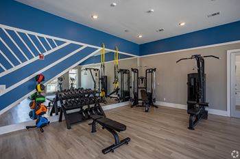 the gym at the enclave at woodbridge apartments in sugar land, tx